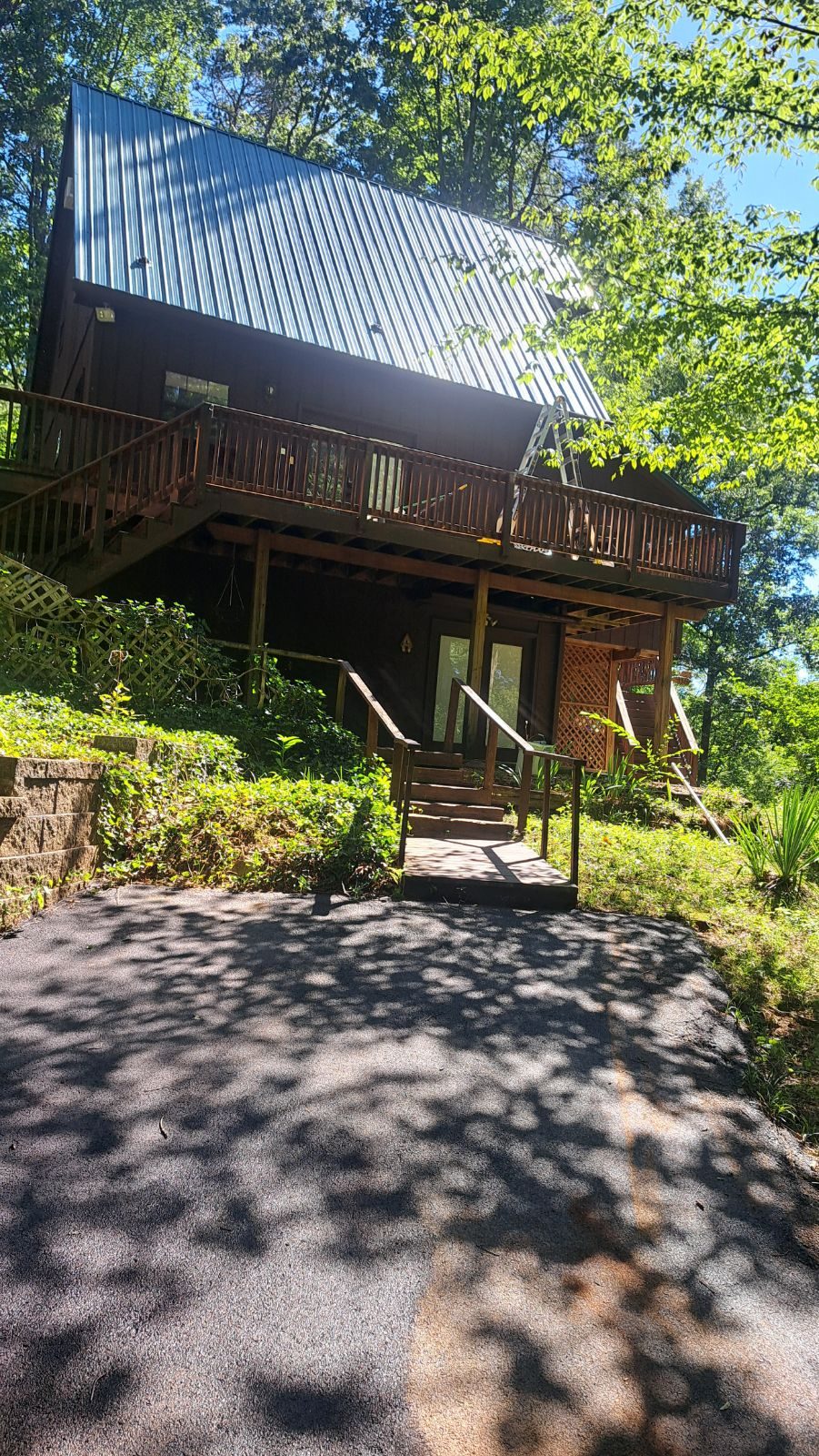 Log cabin and driveway in the hills