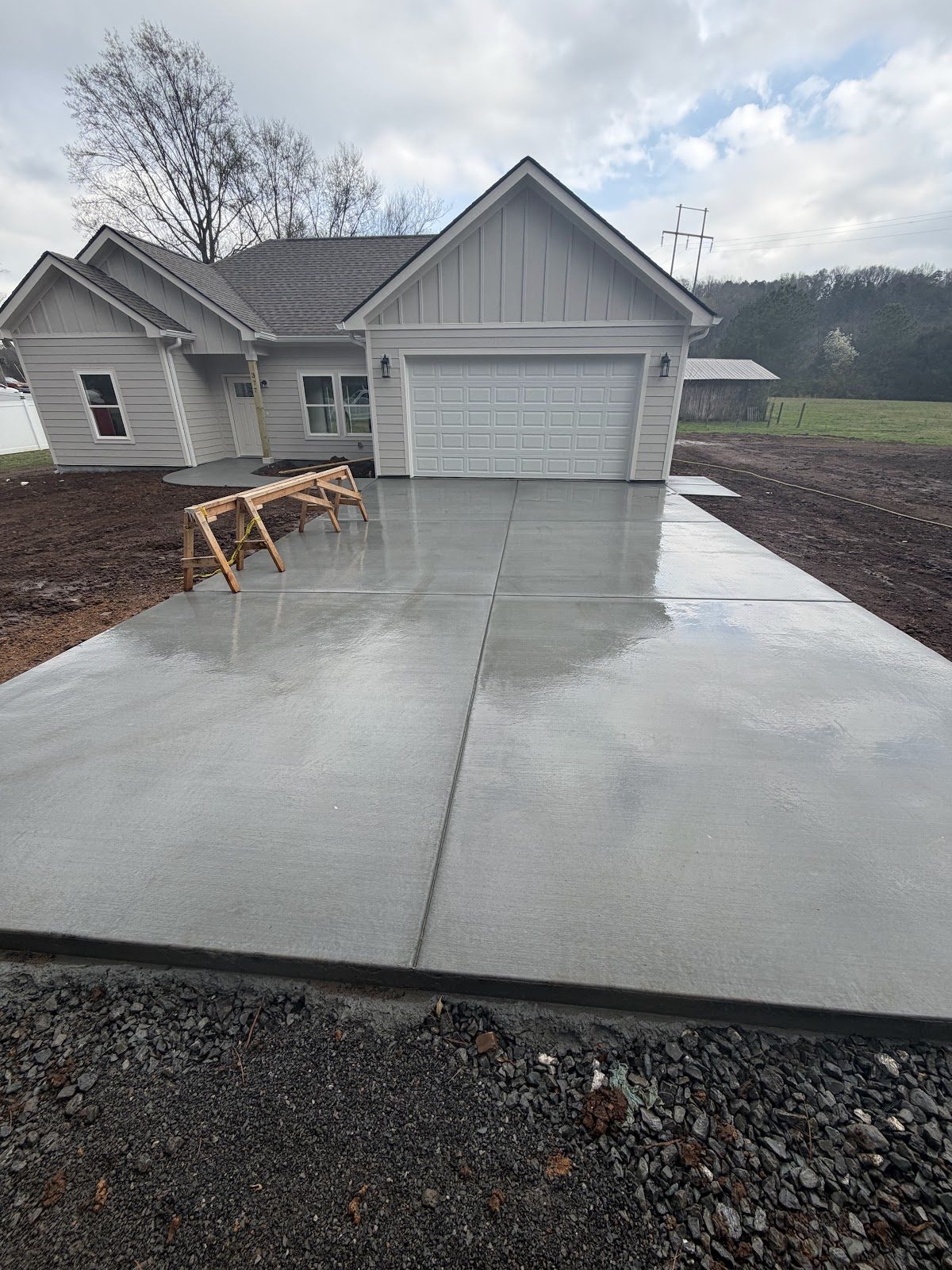 Clean new concrete driveway in front of a new home