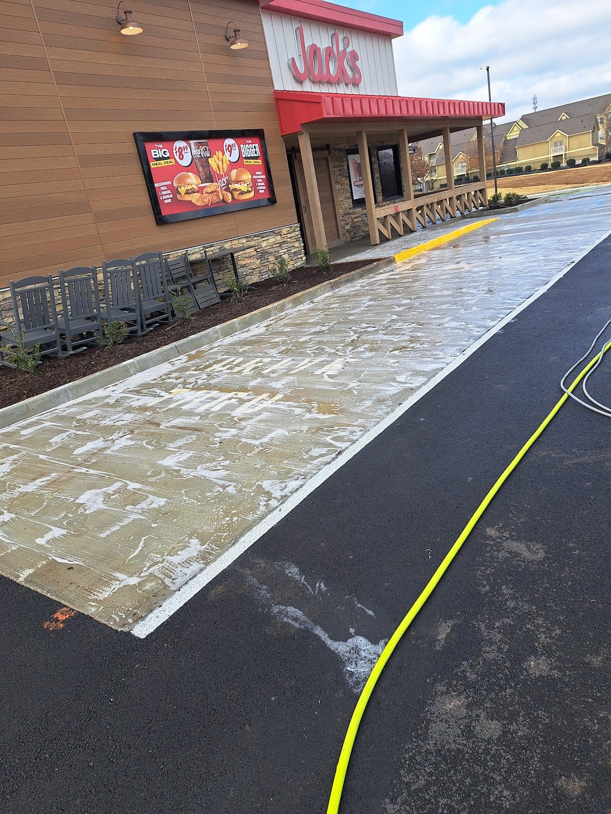 Commercial drive-thru concrete being cleaned