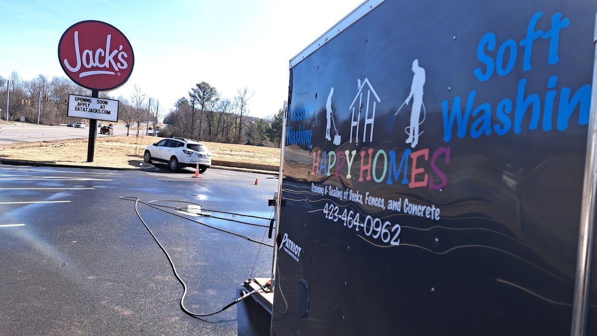 Happy Homes soft washing trailer on a commercial job