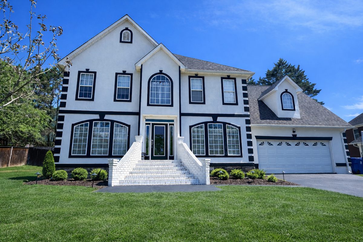Bright white two-storey home after an exterior wash
