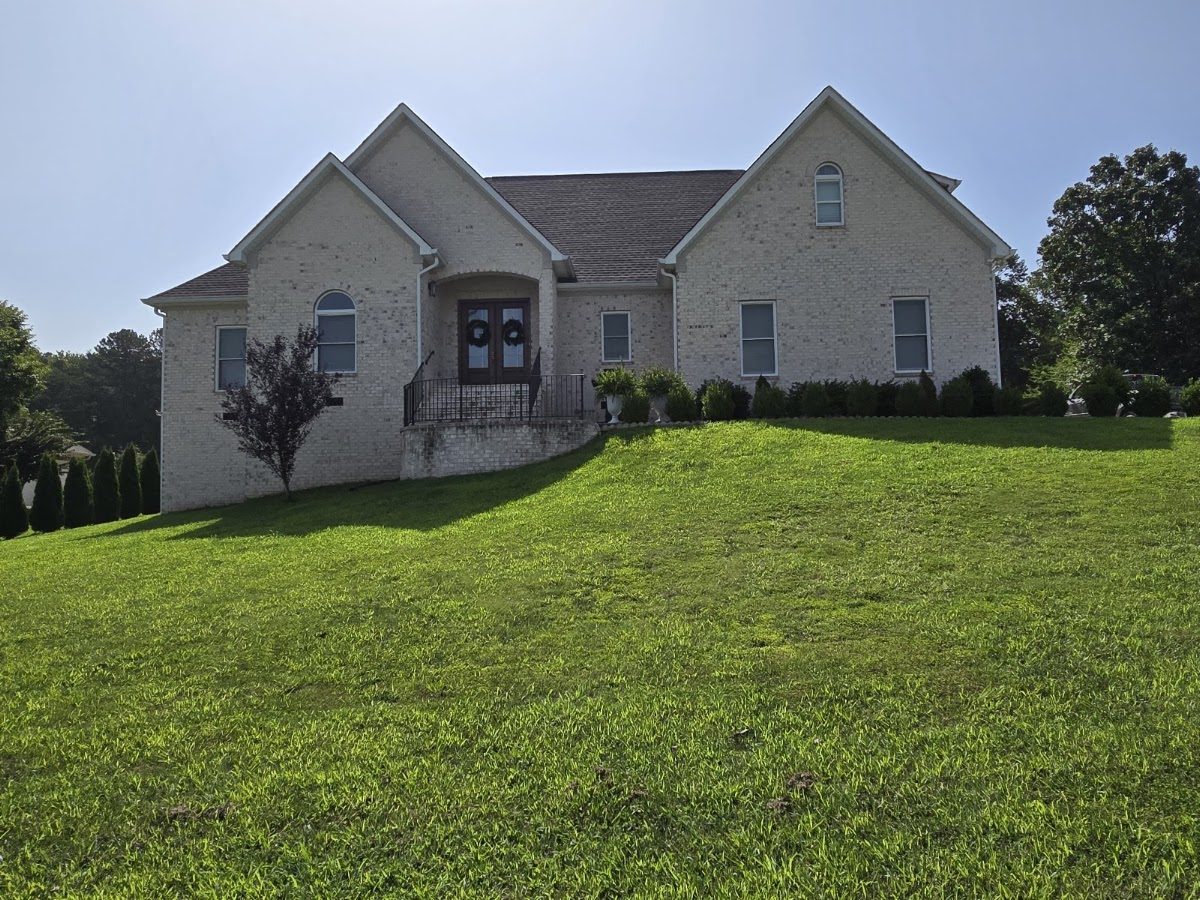Brick home and lawn after an exterior wash